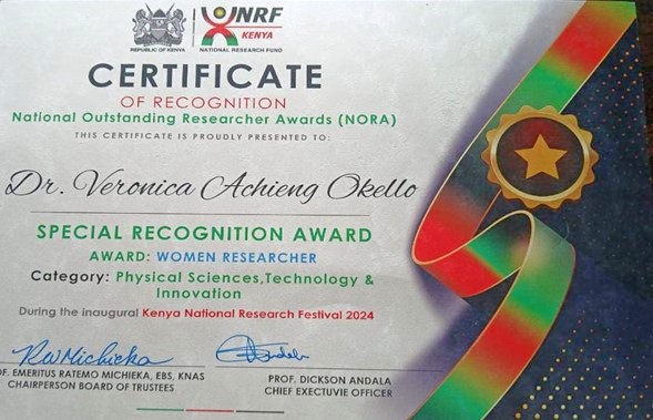 Dr. Veronica Okello receives a special recognition award under women researchers