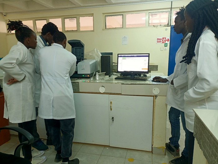 Fourth year students analyzing their samples using ATR-FTIR in the Chemistry Laboratory
