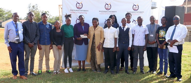 The Go-Green Club being presented with a gift after emerging position one in the students’ category during  the 7th Machakos University Innovation, Exhibition and Medical camp on 13th March 2025 week